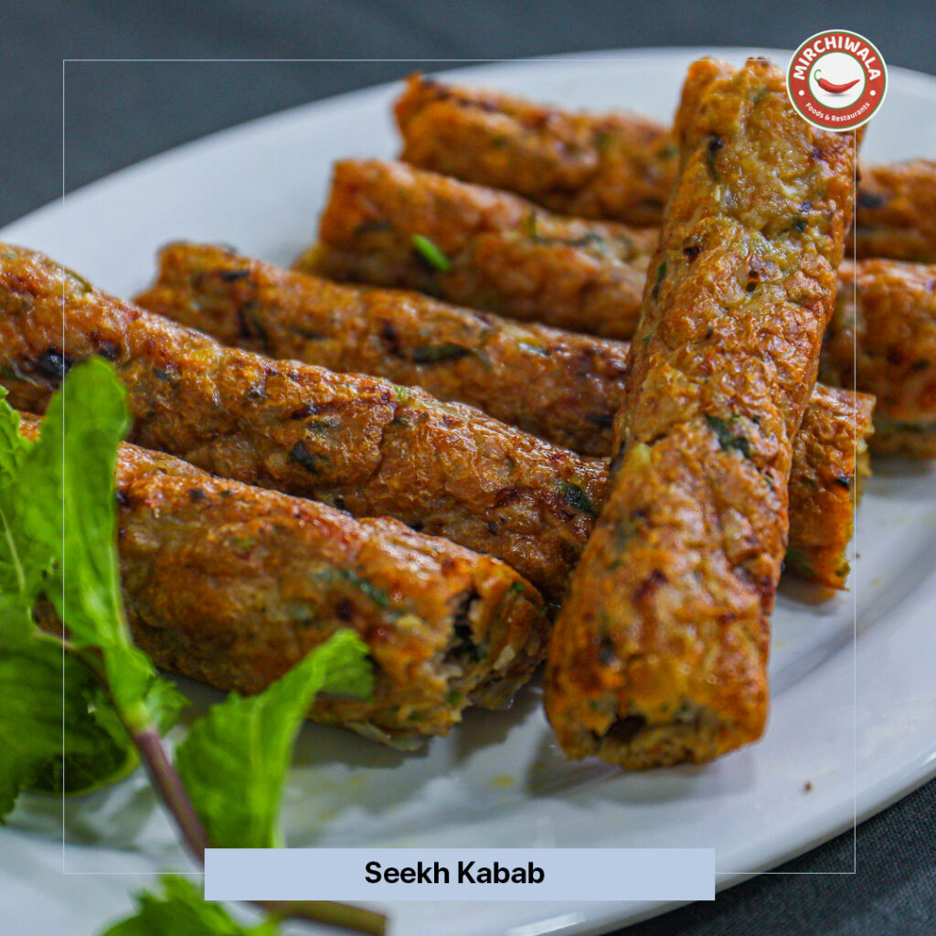 Succulent minced mutton skewers blended with green chilies, herbs, and traditional spices, grilled over charcoal and served fresh with mint chutney.